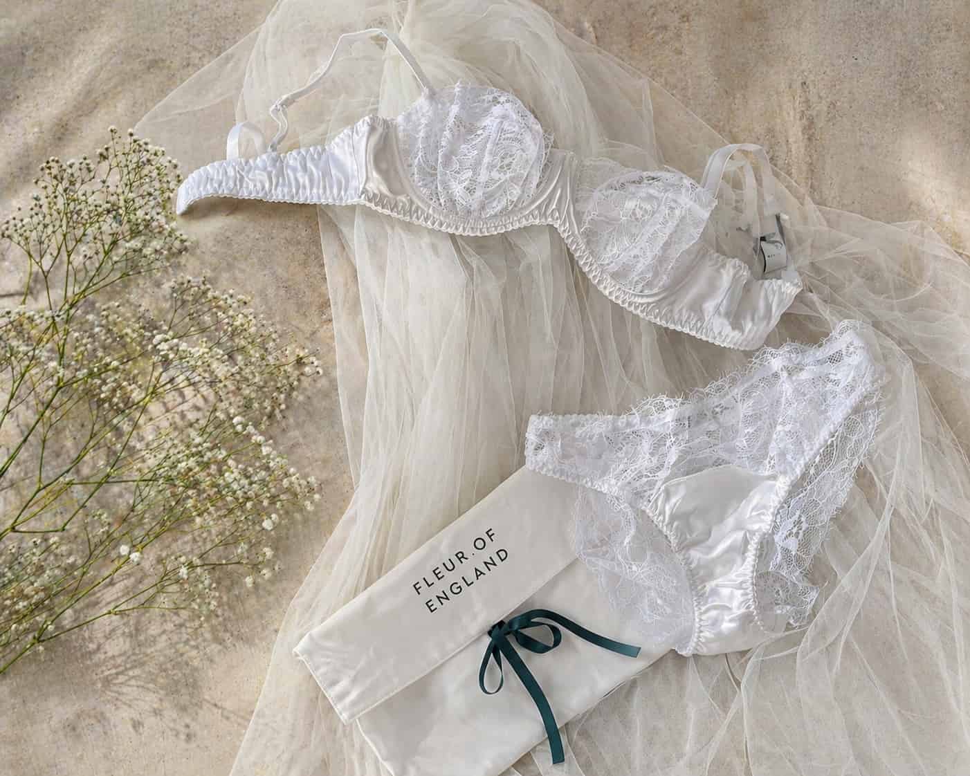 White lace lingerie set with 'Flour of England' tag on a neutral background