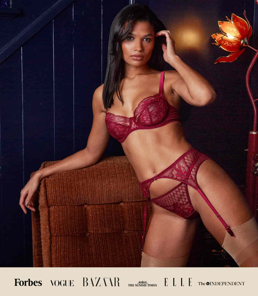 Fleur of england red lace luxury balcony bra, thong and suspender belt lingerie set worn by model