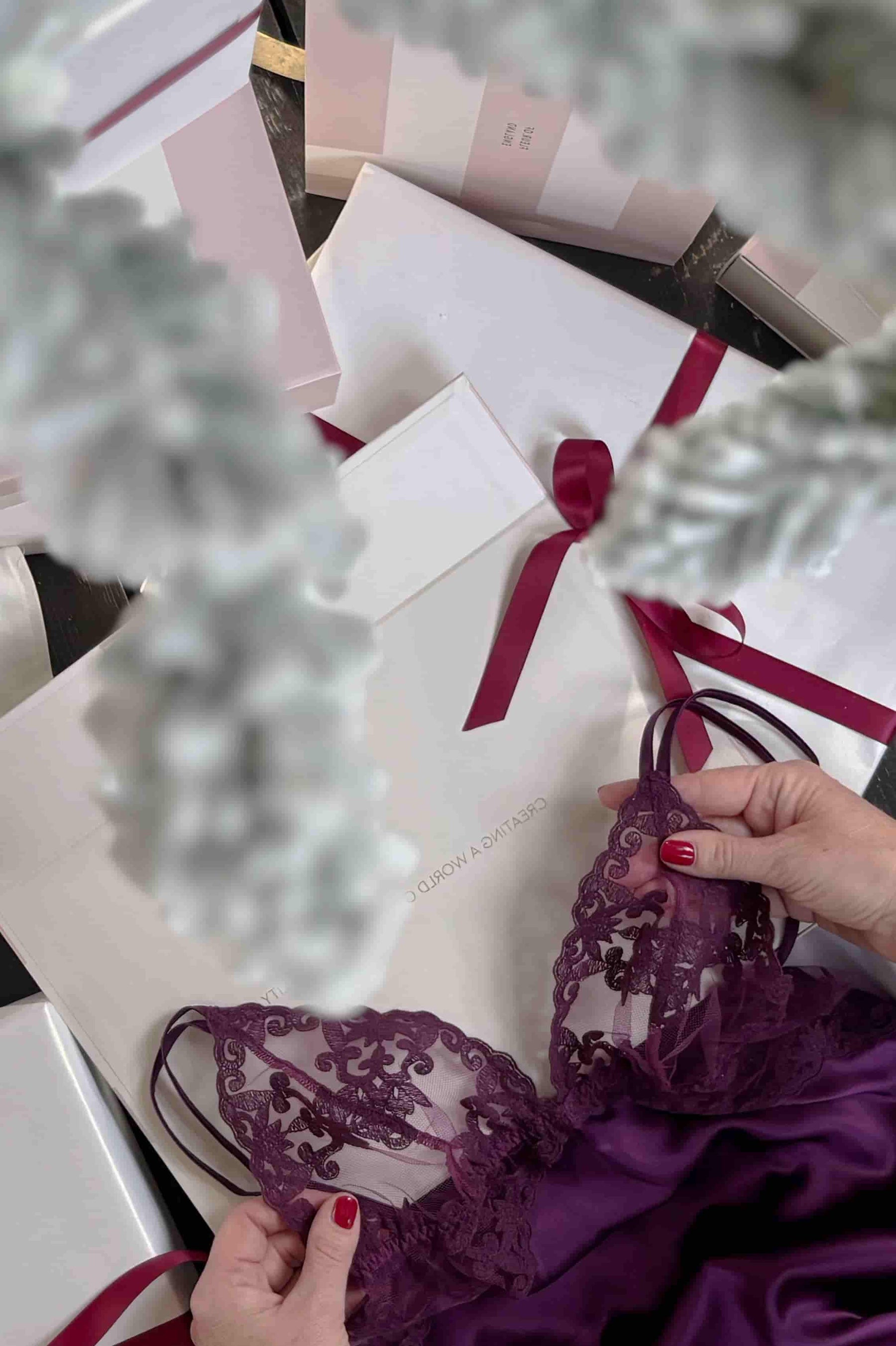Woman unwrapping luxury silk christmas gift by fleur of england