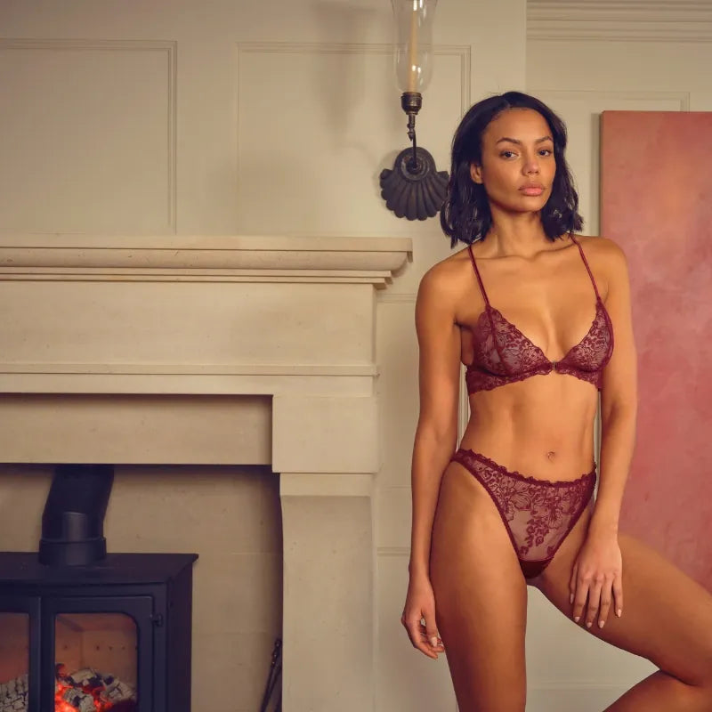 Model wearing luxury plum red non wired bra with brazilian brief lingerie set by fleur of england